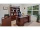 Functional home office with a large desk, built-in bookcase, and natural light, ideal for remote work at 263 Jefferson Ave, Canton, GA 30114