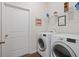 Well-organized laundry room with modern washer and dryer, ample shelving, and a bright, clean feel at 263 Jefferson Ave, Canton, GA 30114