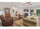 Inviting living room with a fireplace, comfortable seating, and an open layout leading to other areas of the home at 263 Jefferson Ave, Canton, GA 30114