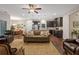 Open-concept living room and kitchen area with hardwood floors and modern appliances at 263 Jefferson Ave, Canton, GA 30114