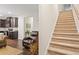 Open-concept living room and kitchen area with stairs to the upper level at 263 Jefferson Ave, Canton, GA 30114