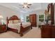 Elegant main bedroom features tray ceilings, carpet and furniture at 263 Jefferson Ave, Canton, GA 30114