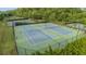Aerial shot of well-maintained community tennis courts surrounded by greenery at 263 Jefferson Ave, Canton, GA 30114