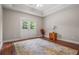 Bedroom with hardwood floors, double doors to balcony, and tray ceilings at 2832 Springbluff Ln, Buford, GA 30519