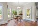 Charming breakfast nook with hardwood floors and a view of the backyard at 2832 Springbluff Ln, Buford, GA 30519