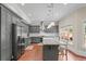 Spacious eat-in kitchen features gray cabinets, stainless steel appliances, and granite countertops at 2832 Springbluff Ln, Buford, GA 30519
