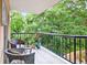 Balcony featuring outdoor seating and views of lush greenery at 1 Biscayne Nw Dr # 112, Atlanta, GA 30309
