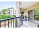 Balcony overlooking trees and a neighboring building at 1 Biscayne Nw Dr # 112, Atlanta, GA 30309