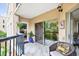 Balcony with outdoor seating and views of landscaping at 1 Biscayne Nw Dr # 112, Atlanta, GA 30309