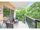 Balcony featuring outdoor seating and lush green views at 1 Biscayne Nw Dr # 112, Atlanta, GA 30309