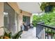 Balcony with outdoor seating and views of lush greenery at 1 Biscayne Nw Dr # 112, Atlanta, GA 30309