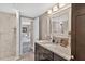 Granite countertop vanity and walk-in shower with tiled walls are bathroom highlights at 1 Biscayne Nw Dr # 112, Atlanta, GA 30309