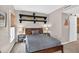 Well-lit bedroom with floating shelves and modern decor at 1 Biscayne Nw Dr # 112, Atlanta, GA 30309