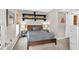 Light-filled bedroom featuring floating shelves and a modern sliding barn door at 1 Biscayne Nw Dr # 112, Atlanta, GA 30309