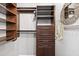 Well-organized walk-in closet with custom shelving and ample storage space at 1 Biscayne Nw Dr # 112, Atlanta, GA 30309