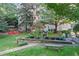Beautiful courtyard featuring a stone fountain, lush landscaping, and a charming seating area at 1 Biscayne Nw Dr # 112, Atlanta, GA 30309