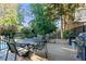 Community deck with outdoor seating and grills, perfect for entertaining and enjoying the outdoors at 1 Biscayne Nw Dr # 112, Atlanta, GA 30309