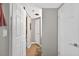 Inviting hallway featuring tile flooring and convenient access to the bathroom at 1 Biscayne Nw Dr # 112, Atlanta, GA 30309