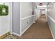 Neutral hallway with carpeted floor, and fire alarm on ceiling at 1 Biscayne Nw Dr # 112, Atlanta, GA 30309