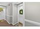 Hallway featuring entry door adorned with a decorative wreath at 1 Biscayne Nw Dr # 112, Atlanta, GA 30309