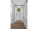 Hallway featuring front door, decorative wreath and a 