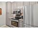 Updated kitchen features stainless steel appliances and ample storage space at 1 Biscayne Nw Dr # 112, Atlanta, GA 30309
