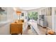 Cozy living room with a modern yellow couch, sliding door to balcony, and stylish décor at 1 Biscayne Nw Dr # 112, Atlanta, GA 30309