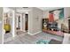 Inviting living room leads into a bedroom with a closet and features a TV and modern art at 1 Biscayne Nw Dr # 112, Atlanta, GA 30309