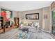 Comfortable living room with a love seat, side table, artful decor and sliding doors to the balcony at 1 Biscayne Nw Dr # 112, Atlanta, GA 30309