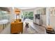 Cozy living room with a modern yellow couch, sliding door to balcony, and stylish décor at 1 Biscayne Nw Dr # 112, Atlanta, GA 30309
