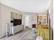 Bright living room features a television, modern furniture, and stylish decor at 1 Biscayne Nw Dr # 112, Atlanta, GA 30309