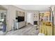 Bright living room features a television, modern furniture, and a sliding glass door to the outside at 1 Biscayne Nw Dr # 112, Atlanta, GA 30309