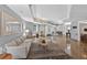 Spacious lobby features an elegant sofa, mirror and marble flooring, creating a warm welcome at 1 Biscayne Nw Dr # 112, Atlanta, GA 30309