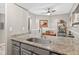 Stylish wet bar features granite countertops and a stainless steel faucet at 1 Biscayne Nw Dr # 112, Atlanta, GA 30309