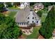 Aerial view of backyard with lush green lawn, deck, and fire pit at 1254 Hadaway Garden Nw Dr, Kennesaw, GA 30152