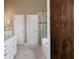 Beautiful bathroom features a white vanity, soaking tub, and glass shower at 1254 Hadaway Garden Nw Dr, Kennesaw, GA 30152