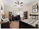 Comfortable bedroom with a ceiling fan, carpet, and desk space at 1254 Hadaway Garden Nw Dr, Kennesaw, GA 30152