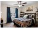 Bedroom with ceiling fan, large window, and fun rustic decor at 1254 Hadaway Garden Nw Dr, Kennesaw, GA 30152