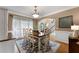 Bright dining room with hardwood floors and an arched doorway at 1254 Hadaway Garden Nw Dr, Kennesaw, GA 30152