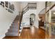 Welcoming entryway with hardwood floors, staircase, and decorative accents at 1254 Hadaway Garden Nw Dr, Kennesaw, GA 30152
