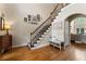 Grand entryway with hardwood floors and staircase leading to the upper level at 1254 Hadaway Garden Nw Dr, Kennesaw, GA 30152