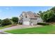 Beautiful two-story home with gray brick, attached garage, mature landscaping, and large driveway at 1254 Hadaway Garden Nw Dr, Kennesaw, GA 30152