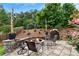 Inviting patio space with stone fire pit, comfortable seating and woodpile create an ideal setting at 1254 Hadaway Garden Nw Dr, Kennesaw, GA 30152