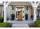 Close-up of front porch featuring beautiful plants, brick exterior and craftsman style details at 1254 Hadaway Garden Nw Dr, Kennesaw, GA 30152