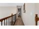 Upstairs hallway with neutral walls and carpet leading to the bedrooms and bathrooms at 1254 Hadaway Garden Nw Dr, Kennesaw, GA 30152