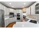Bright kitchen with white countertops, stainless steel appliances, and hardwood flooring at 1254 Hadaway Garden Nw Dr, Kennesaw, GA 30152
