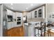 Bright kitchen with white cabinetry, stainless steel appliances, and breakfast bar seating at 1254 Hadaway Garden Nw Dr, Kennesaw, GA 30152