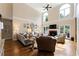 Bright living room featuring a soaring ceiling, tall windows, fireplace, and hardwood flooring at 1254 Hadaway Garden Nw Dr, Kennesaw, GA 30152