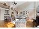Spacious living room with hardwood floors, fireplace, and ample natural light, with view of upstairs landing at 1254 Hadaway Garden Nw Dr, Kennesaw, GA 30152