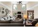 Sunlit living room boasting a fireplace, tall windows, and hardwood flooring, with view to breakfast nook at 1254 Hadaway Garden Nw Dr, Kennesaw, GA 30152